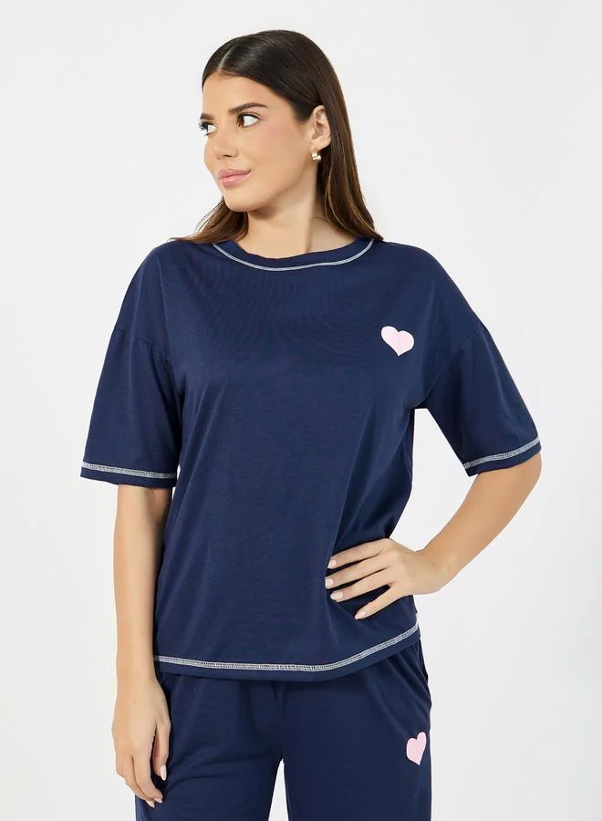 ستايلي اكتيف تيشيرت فضفاض محبوك بطبعة جرافيك